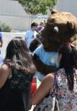 The FIRST 5 mascot with a parents.